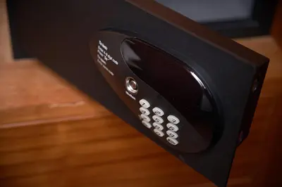 a close up of a remote control in a room at KC Place Hotel Pratunam in Bangkok