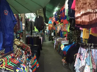 a store filled with lots of clothes and merchandise at Backpack Station in Bangkok