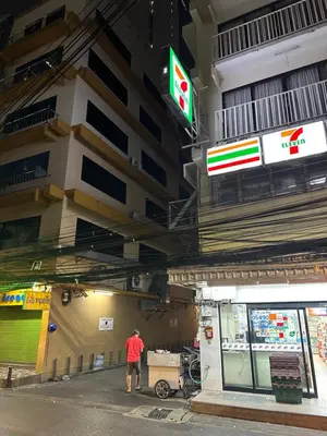 a man standing in front of a building at Dreamcatcher Bangkok in Bangkok