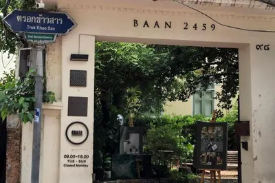 an entrance to a building with a sign that at Baan 2459 Heritage House in Bangkok