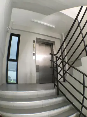 a spiral staircase in a building with a door at 28 Place in Bangkok