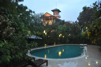a swimming pool in the yard of a house at Chakrabongse Villas in Bangkok