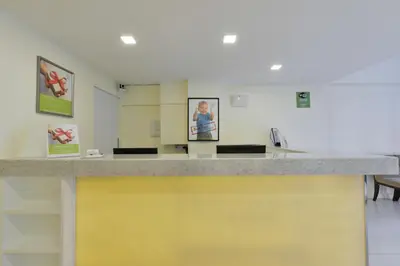 a yellow and gray counter in a room at iCheck inn Sukhumvit 19 in Bangkok