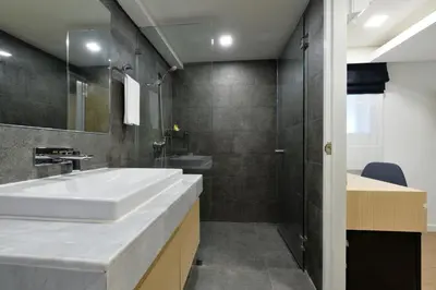 a bathroom with a sink and a shower at iCheck inn Sukhumvit 19 in Bangkok