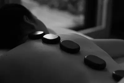 a close up of three black buttons on a remote control at Hansar Bangkok Hotel in Bangkok