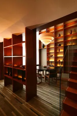 a dining room with a table and a dining room at Hansar Bangkok Hotel in Bangkok