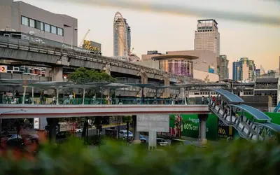 a city with tall buildings and a bridge at Lub d Bangkok Siam - New Look, Across from MBK & Skytrain Access in Bangkok