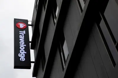a store sign on the side of a building at Travelodge Sukhumvit 11 in Bangkok