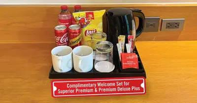 a black tray with cups and drinks on a counter at Travelodge Sukhumvit 11 in Bangkok