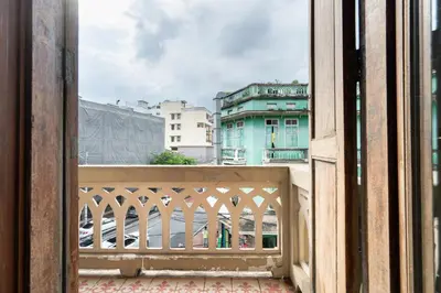 an open window with a view of a city at Arun Sa Wad 103 NaNa in Bangkok