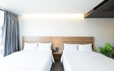 two beds sitting next to each other in a bedroom at STAY Hotel BKK in Bangkok