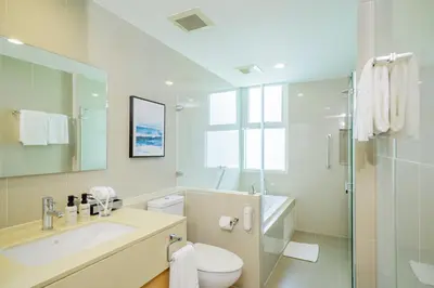a bathroom with a toilet and a sink and a shower at Shama Petchburi 47 Bangkok in Bangkok