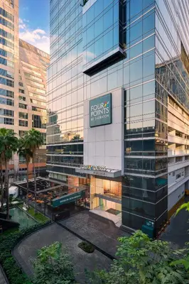 a building with a sign on the side of it at Four Points by Sheraton Bangkok Ploenchit Sukhumvit in Bangkok