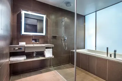a bathroom with a sink and a shower at Four Points by Sheraton Bangkok Ploenchit Sukhumvit in Bangkok