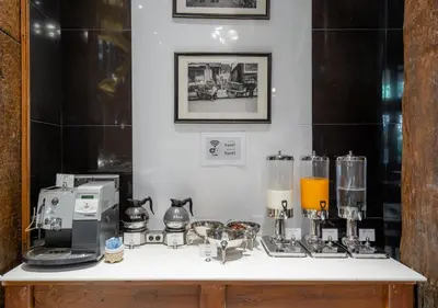 a counter with a bunch of appliances on it at True Siam Phayathai Hotel in Bangkok