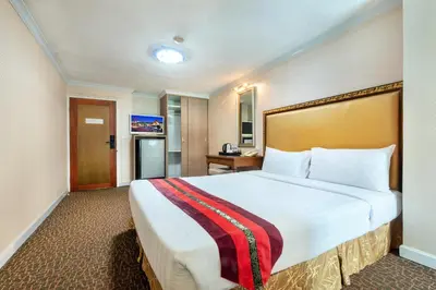 a hotel room with a large bed in a room at NASA BANGKOK - Airport Rail Link Ramkhamhang in Bangkok