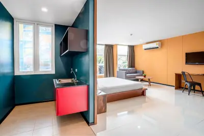 a hotel room with a bed and a sink at MeStyle Place Hotel in Bangkok