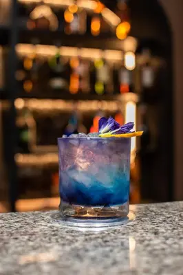 a drink sitting on top of a table at Twin Towers Hotel in Bangkok
