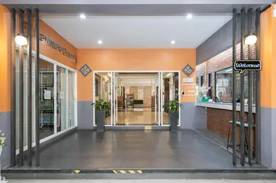 an entrance to a store with orange walls at P-Park Suvarnabhumi in Bangkok