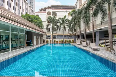 a swimming pool in the middle of a building at P-Park Suvarnabhumi in Bangkok