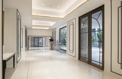 a hallway of a hospital with large windows and a hallwayngth at Radisson Hotel Chateau de Bangkok in Bangkok
