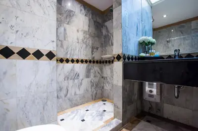 a bathroom with a sink and a shower at Buddy Lodge, Khaosan Road in Bangkok
