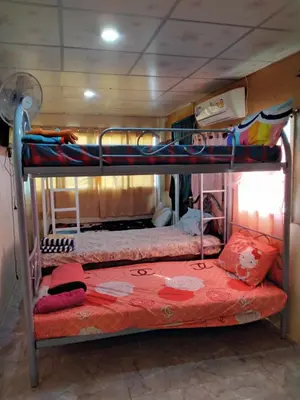 a couple of bunk beds in a room at Danee Hostel in Bangkok