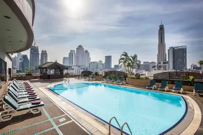 a swimming pool on top of a building with a city skyline at Ramada by Wyndham D MA Bangkok in Bangkok