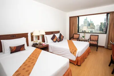 a hotel room with two beds and a large window at Ramada by Wyndham D MA Bangkok in Bangkok