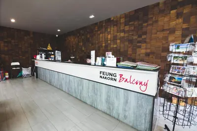 a serving station in a store with a person behind the counter at Feung Nakorn Balcony Rooms and Cafe in Bangkok