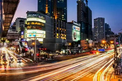 a busy city street at night with buildings at Night Hotel Bangkok - Sukhumvit 15 in Bangkok