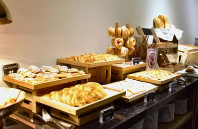 a bakery with many different types of pastries on display at Ambassador Hotel Bangkok in Bangkok