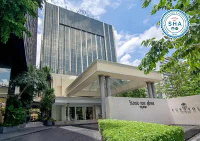 a building with a sign in front of it at The Sukosol Hotel in Bangkok