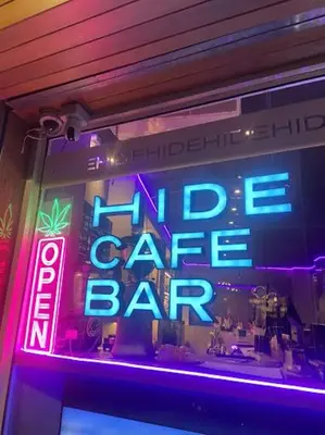 a sign in the window of a fire cafe bar at Thai Cozy House in Bangkok