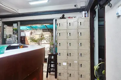 a room with boxes on the wall next to a counter at Amarin Inn in Bangkok