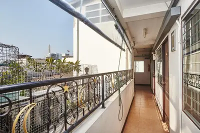 a balcony with a view of the city at Amarin Inn in Bangkok