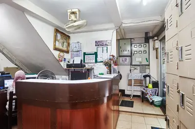 a kitchen with a counter and a sink in a room at Amarin Inn in Bangkok