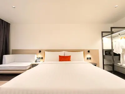 a bedroom with a large white bed and a mirror at Citichic Sukhumvit 13 by Compass Hospitality - Newly Renovated in Bangkok