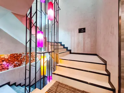 a staircase in a house with colorful lights at Citichic Sukhumvit 13 by Compass Hospitality - Newly Renovated in Bangkok
