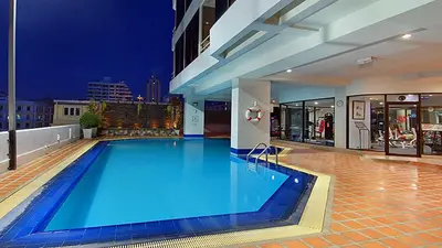 a large swimming pool on top of a building at Tai Pan Hotel in Bangkok