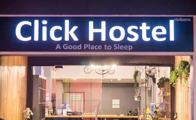 a sign for a chicked hostel with a good place to sleep at Click Hostel in Bangkok