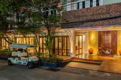 a golf cart parked in front of a building at La Petite Salil Sukhumvit 8 in Bangkok