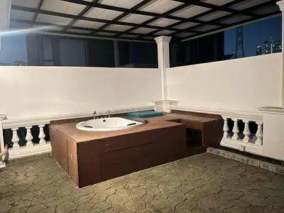 a bathroom with a sink in a building at V20 Boutique Jacuzzi Hotel in Bangkok