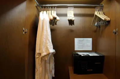 a locker room with a towel and utensils at FuramaXclusive Sathorn, Bangkok in Bangkok