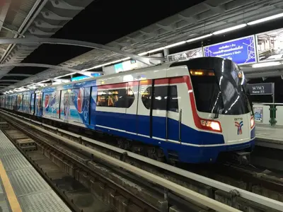 a subway train pulling into a subway station at Aspen Suites Hotel Sukhumvit 2 in Bangkok