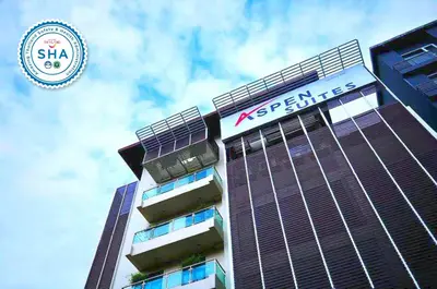 a building with a sign on top of it at Aspen Suites Hotel Sukhumvit 2 in Bangkok
