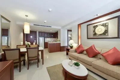a living room with a couch and a table at Centre Point Sukhumvit Thong-Lo in Bangkok