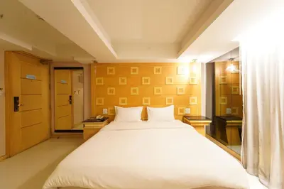 a bedroom with a large white bed in a room at UPAR Hotels Sukhumvit 11 Nana in Bangkok