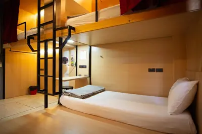 a bedroom with a bunk bed in a room at CLOUD on Saladaeng Silom Hostel Bangkok in Bangkok