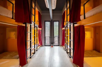 a hallway with bunk beds in a hostel at CLOUD on Saladaeng Silom Hostel Bangkok in Bangkok